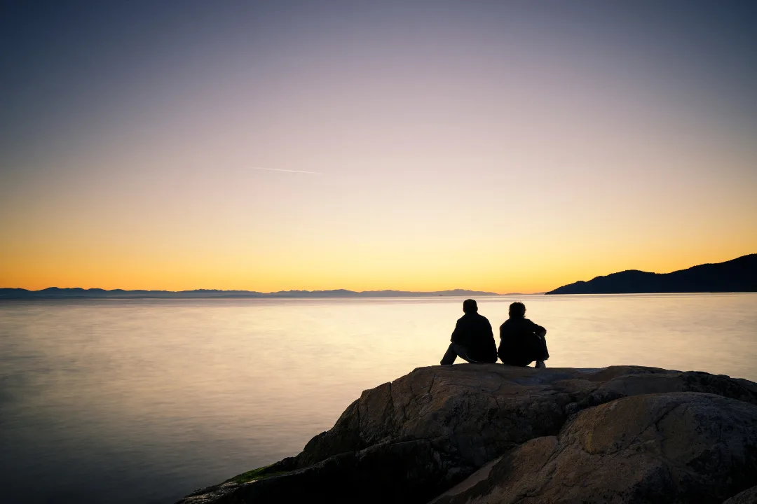 An image representing Sadhuwani's blog 'Don't Respond, Listen,' showing two people sitting together, one speaking and the other listening attentively, symbolizing genuine connection, presence, and understanding without judgment