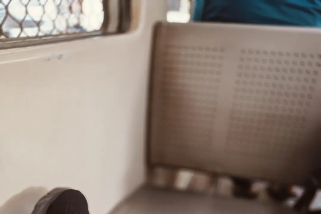 A vacant seat inside a Mumbai local train, with Sadhuwani’s foot resting on the opposite bench, capturing the essence of the blog "Why Didn't He Say Goodbye?"—a reflection on an unexpected conversation about life, loss, and gratitude