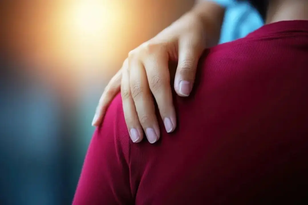 Close-up of a comforting hand on someone’s shoulder, symbolizing empathy, validation, and respect — core themes of the Sadhuwani blog “Respect is Oxygen”.