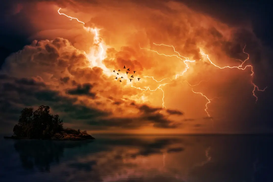 Dramatic sky filled with lightning bolts and flying birds over a calm reflective water body, symbolizing inner turmoil against external calm.